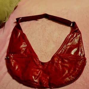 Extra expandable red leather sash bag